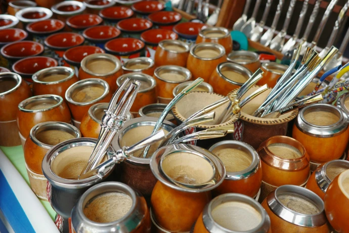 Many gourds filled with yerba mate and bombillas